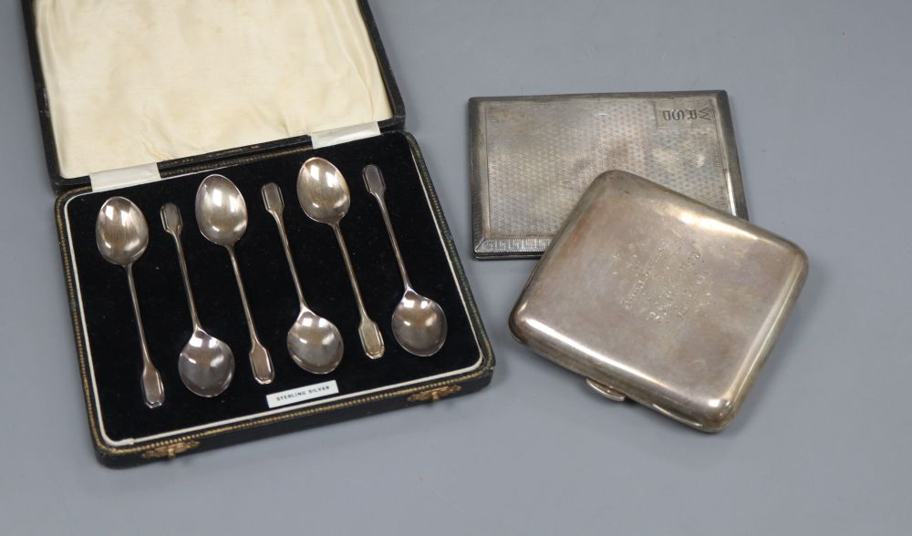Two silver cigarette cases including engine turned and a cased set of six silver teaspoons.